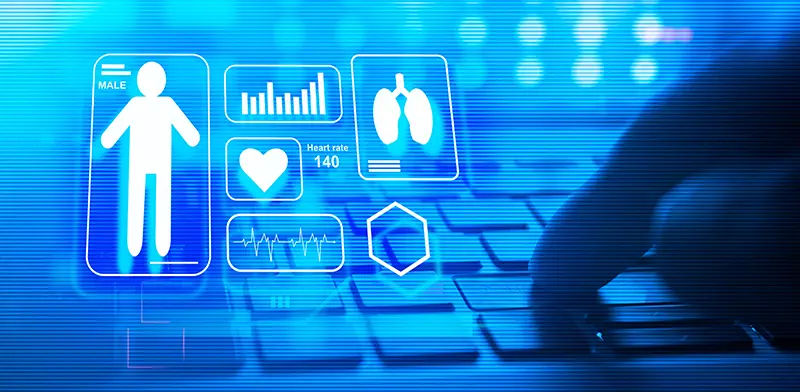 Hand on keyboard with patient icons and health data above, symbolizing custom healthcare software development services.