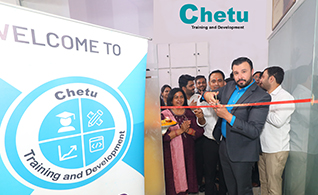 Brian Poole, director of marketing for Chetu, cuts the ribbon to celebrate the opening of a state-of-the-art Skill Development Centre in Noida, India.